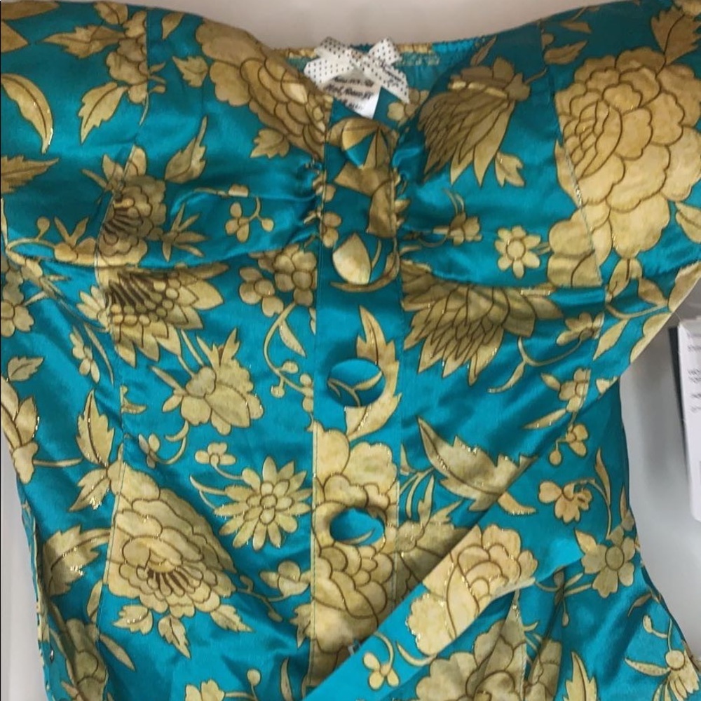 Beautiful brightly colored silk tube top with buttons and gold thread detailing.